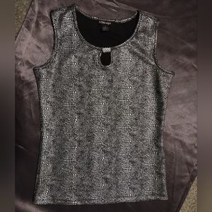 Silver metallic over black sleeveless blouse